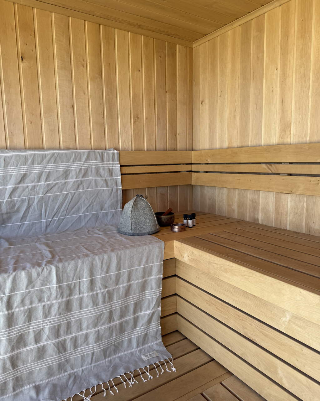 100% certified organic cotton hammam towel/peshtemal/turkish towel and 100% virgin wool sauna hat in use in sauna